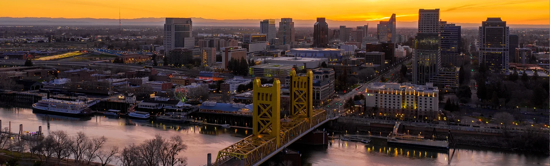 Aerial views of downtown Sacramento skyline and bridges.