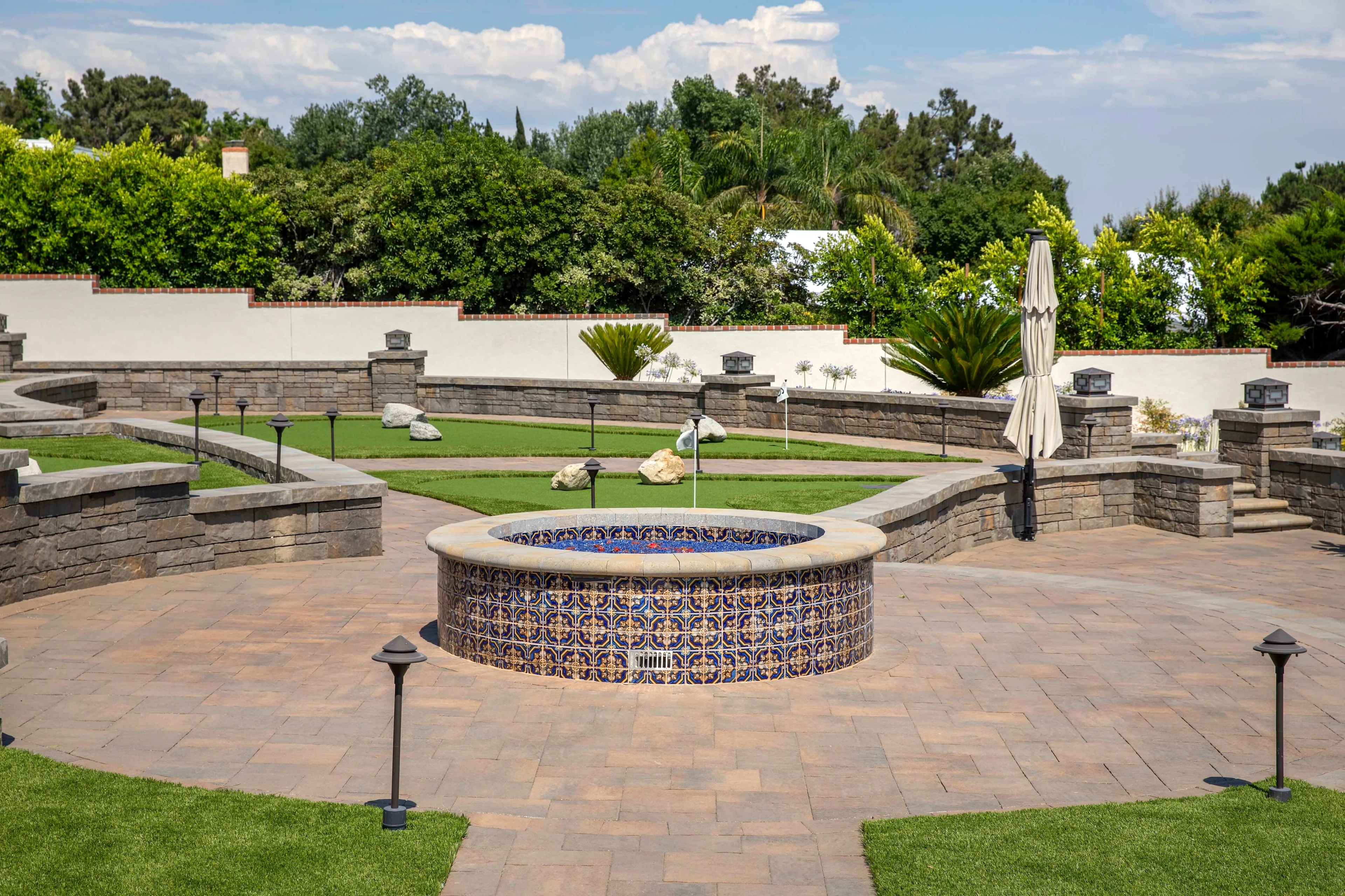 Fehlman after picture tile fire pit with outdoor lighting