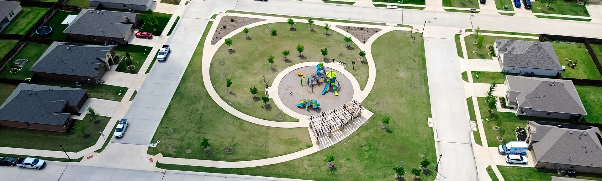 Playground park kids in new construction home neighborhood in fast growing Collin County, North Texas, suburbs