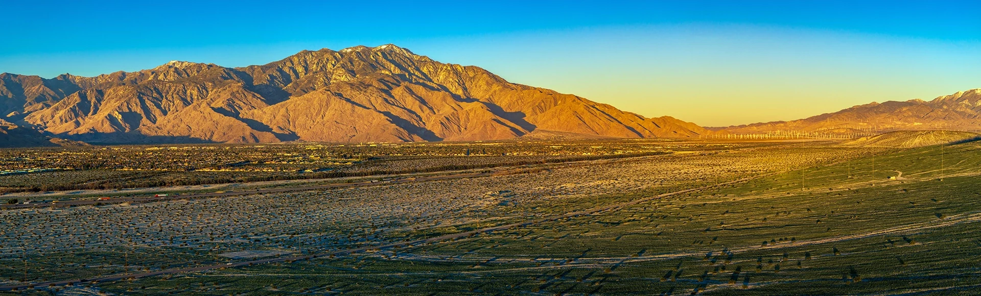 Snow Capped San Jacinto mountain towering over Palm Springs at Sunrise