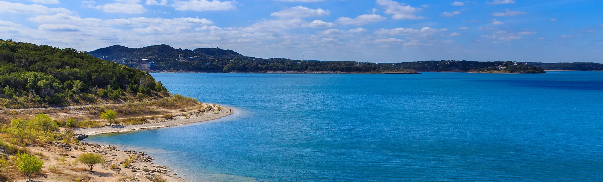 Canyon Lake close to San Antonio, New Braunfels, San Marcos and Wimberley in the Texas hill country. It is part of the Guadalupe River. You can walk on the dam. There are many beaches on the shores.