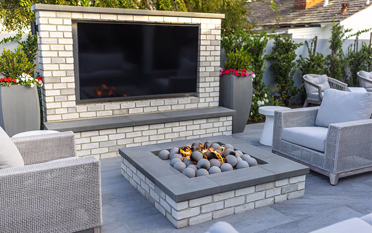 Built-in fireplace and TV on outdoor patio
