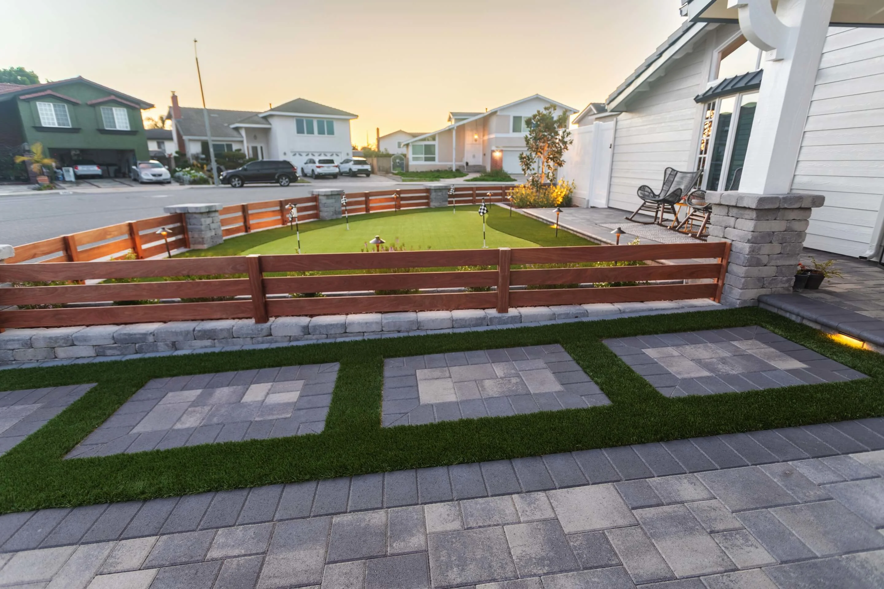 Front Yard With Permeable Paver and Turf Walkway, Retaining Walls, and Putting Green View