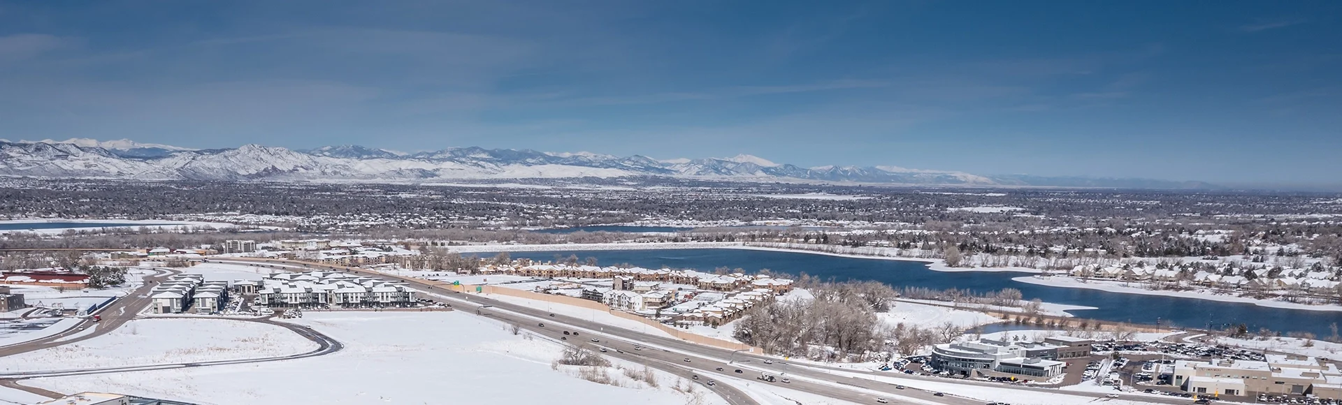 Aerial view of Highlands Ranch commercial buildings skyline in Colorado during after snow storm