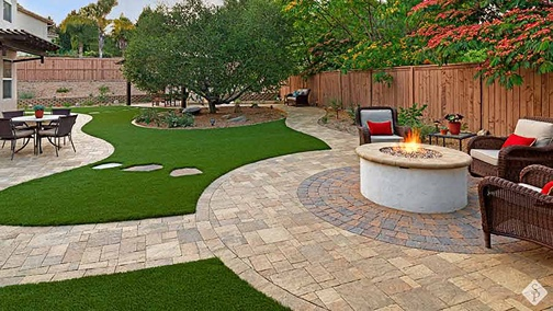 nice yard with pavers and turf