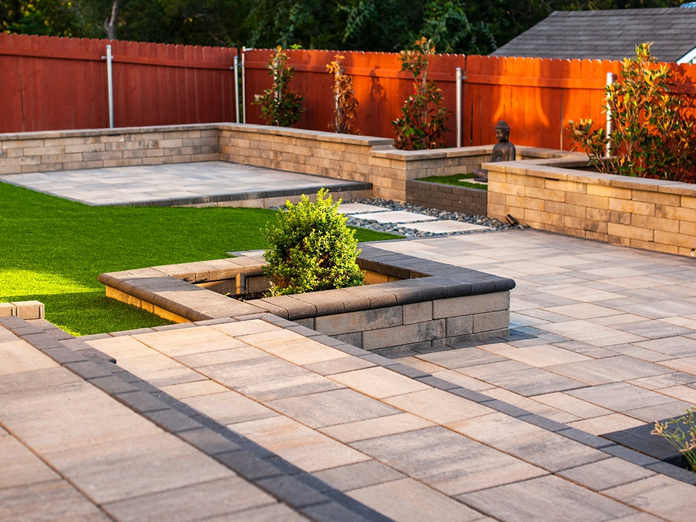 Paver insert with planter boxes and walls.