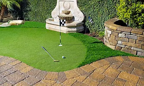 Artificial turf, golf, putting range, water fountain, pavers, retaining wall, artificial grass, backyard ideas, outdoor activities, California, daytime