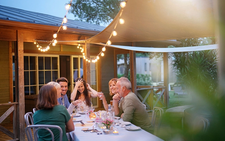 People celebrating on an outdoor patio. 