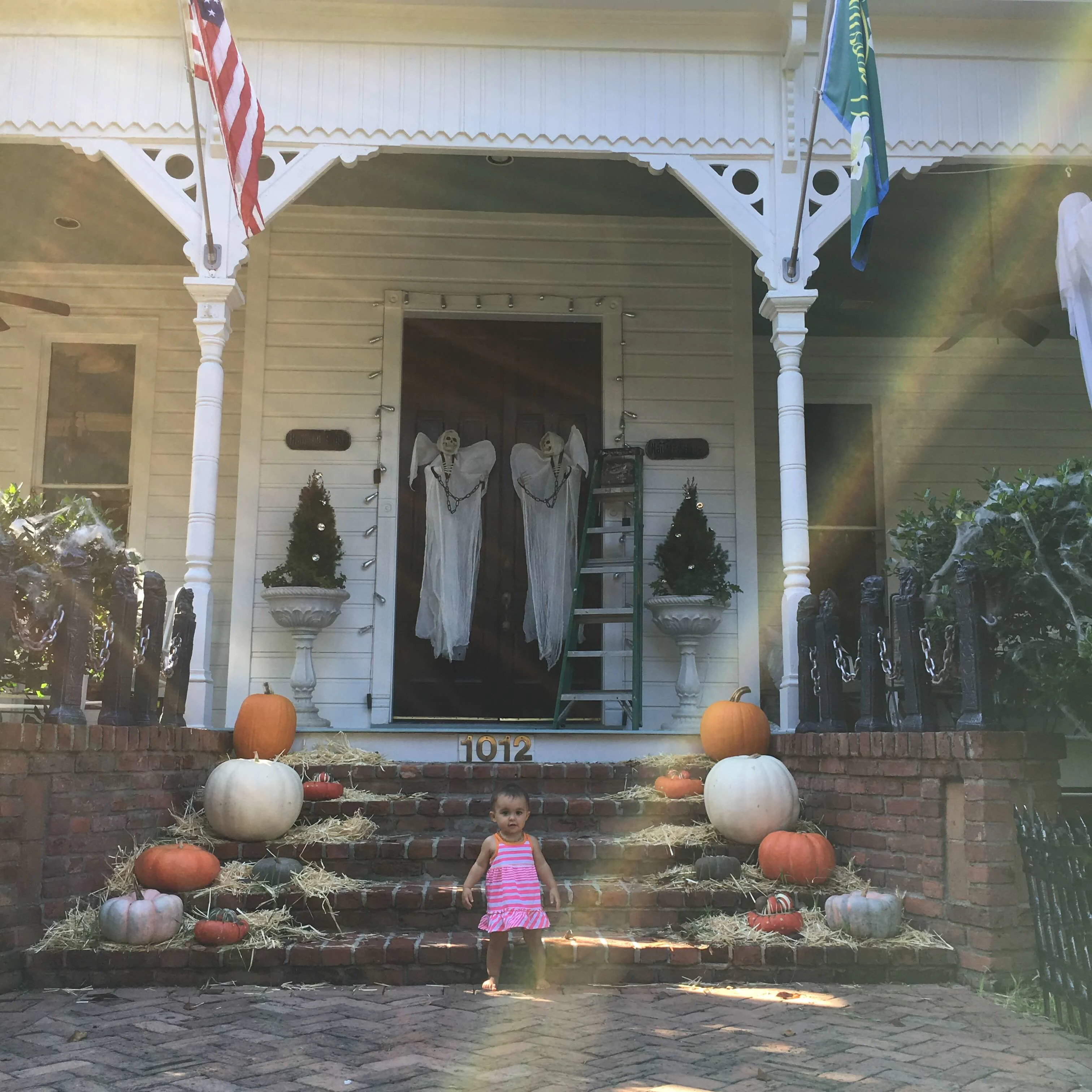 Front porch and entry of Victorian home decorated for Halloween 