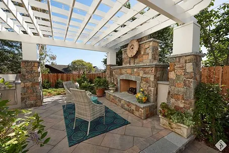 paver patio with pergola and outdoor fireplace