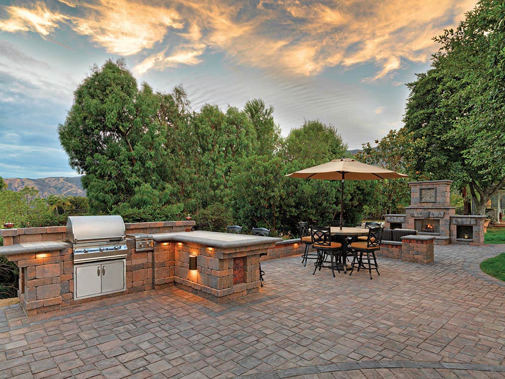 Outdoor patio with kitchen, grill and built-in fire place with a lovely view. 