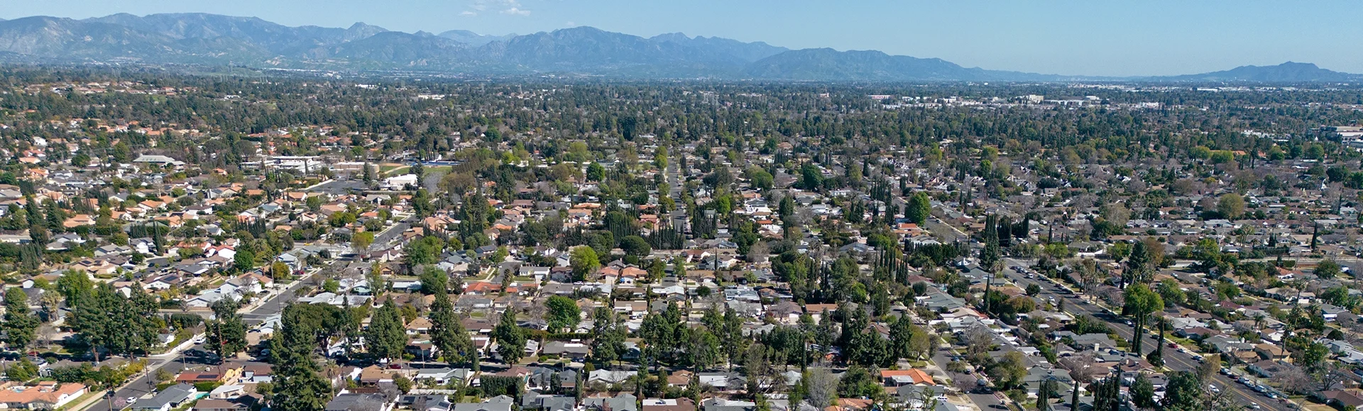 The San Fernando Valley, located in northern section of greater Los Angeles, California is shown from an aerial view during an afternoon day.