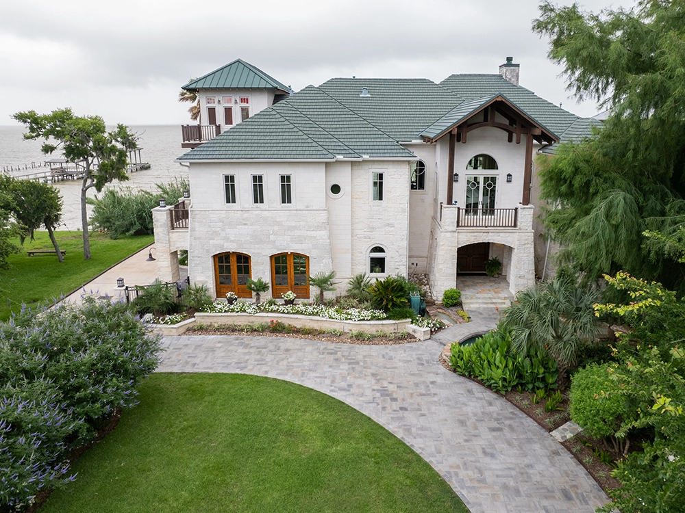 Large, wrap-around paving stone driveway in Texas. 