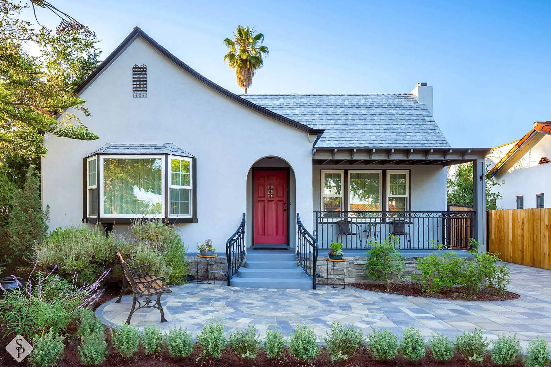 house with paver driveway