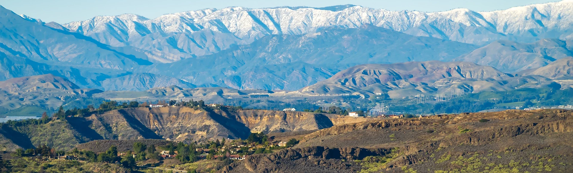 Panoramic of Southern California valleys and mountains after the winter rains with homes in Conejo Thousand Oaks valley in Ventura County