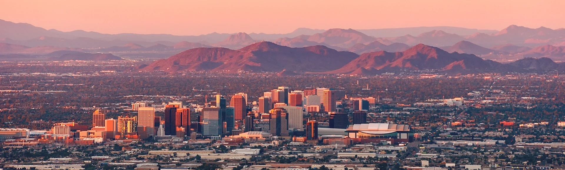 Skyline view of Phoenix Arizona with mountains in the background. 