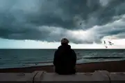 Depressed person at the beach