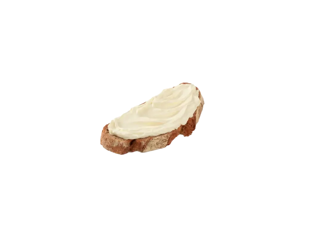Fromage à tartiner sur une tranche de pain