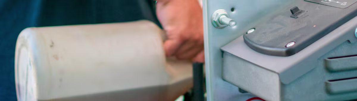 Person putting fuel on a generator
