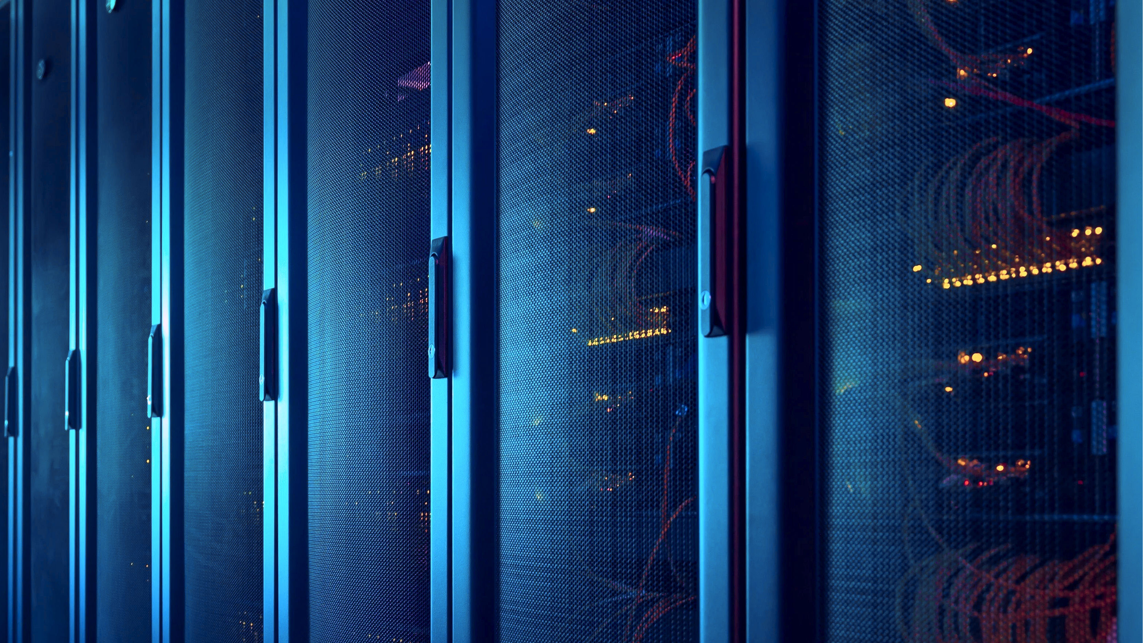 Zoom in of data center enclosure doors in blue tones.
