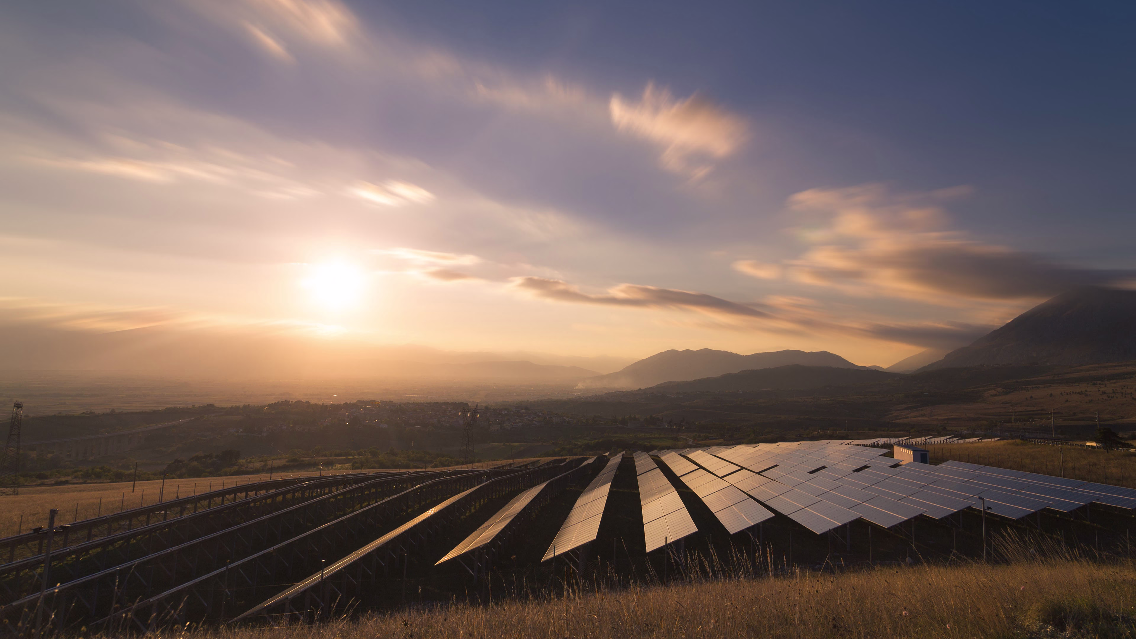 Solar energy installation in a mountain landscape representing sustainability, renewable energy, and environmental responsibility.