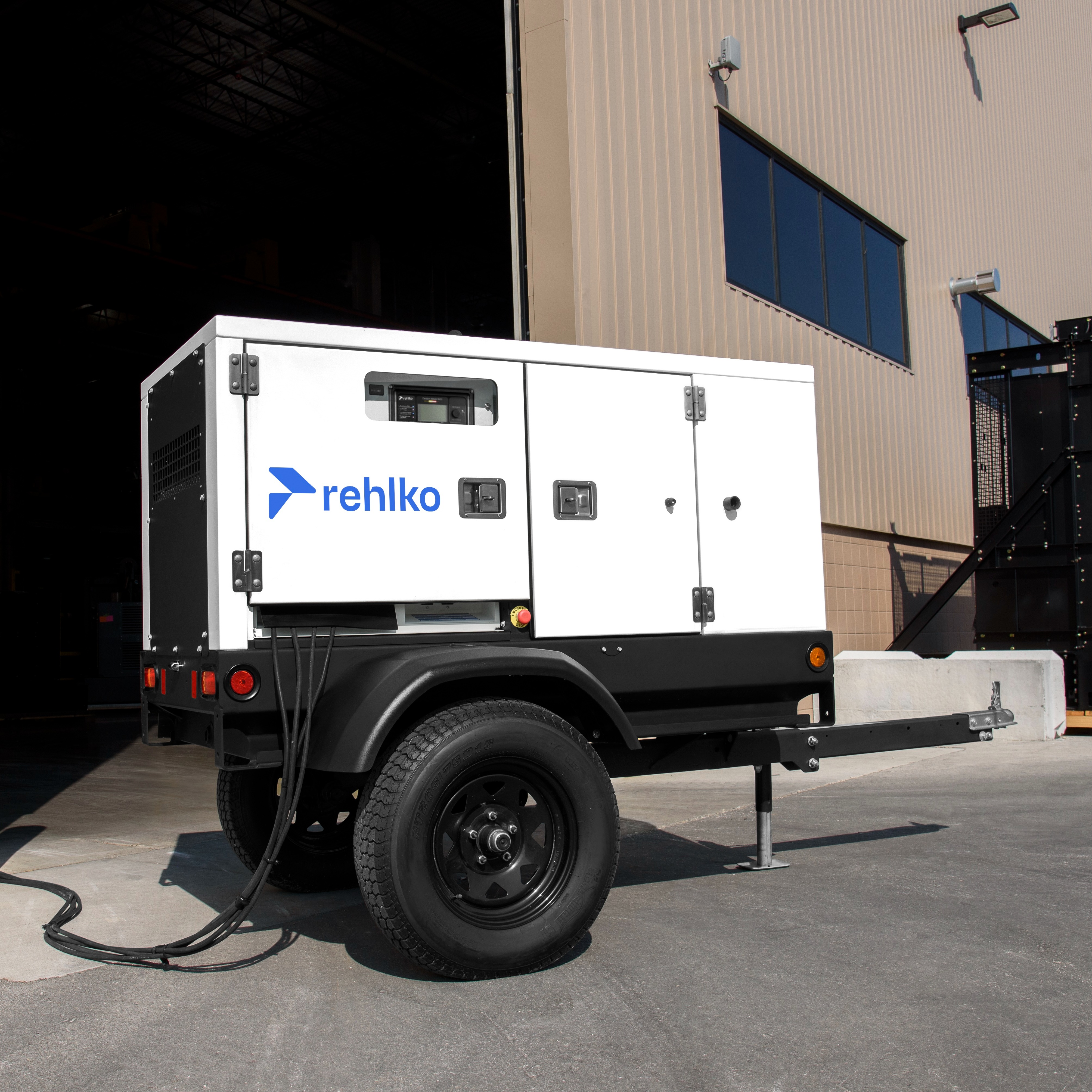 Mobile generator in situ near a building.
