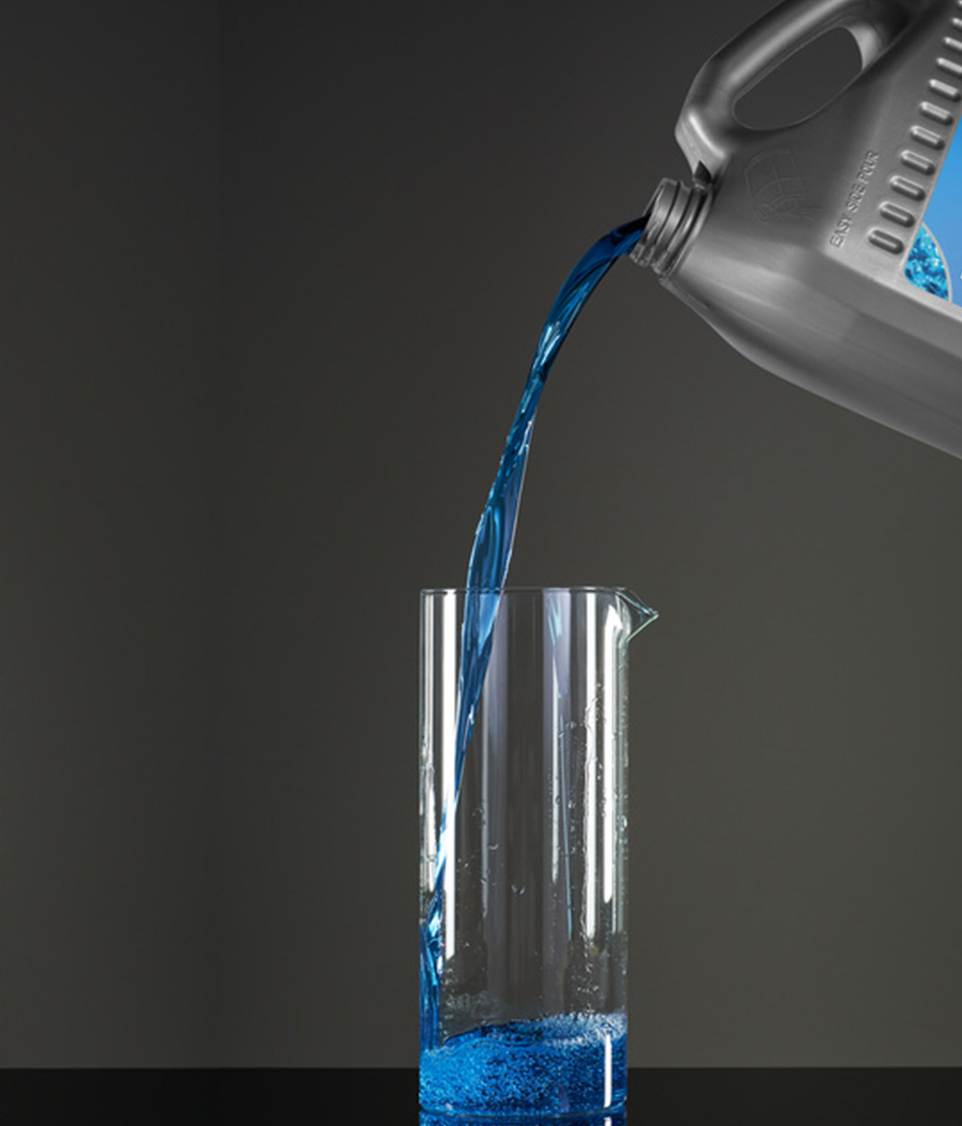 Coolant bottle being poured into a glass vase