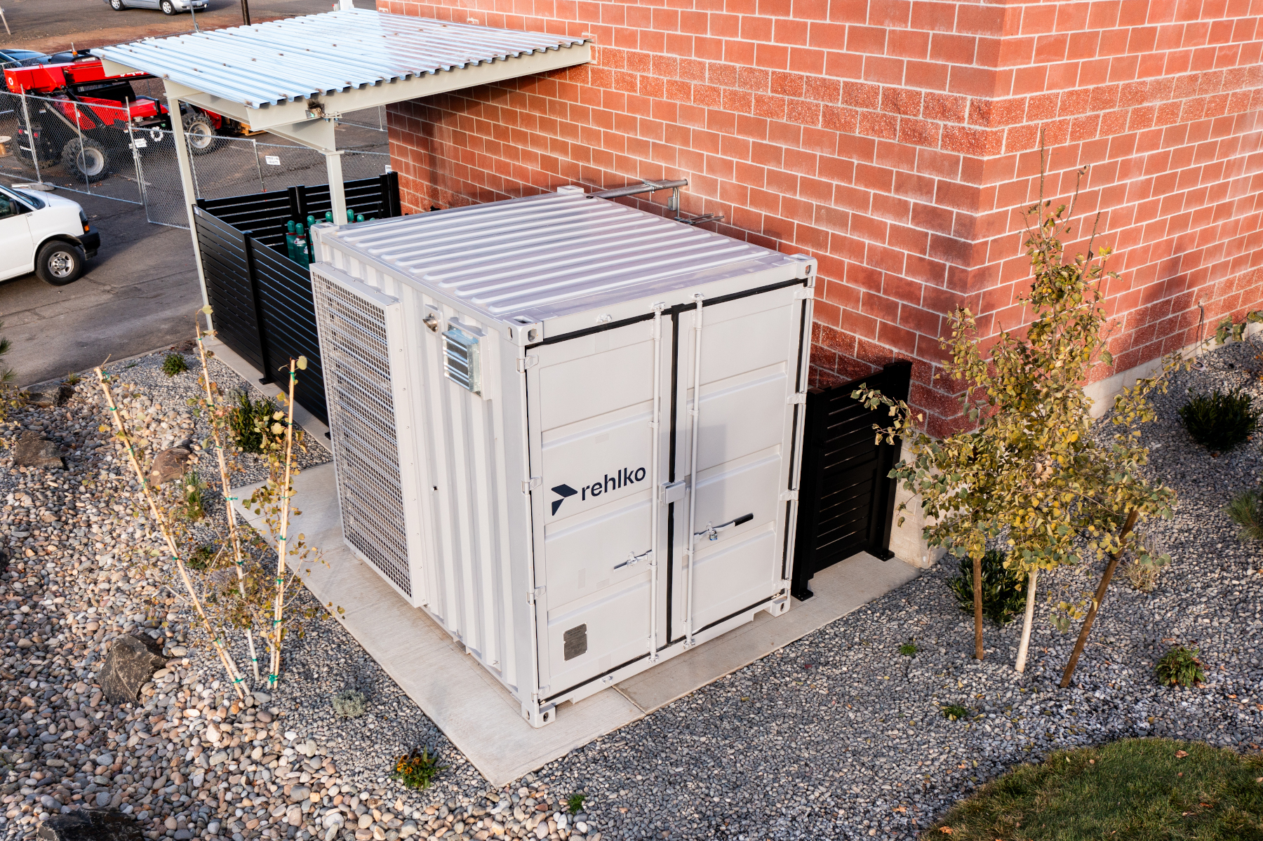 Rehlko Fuel Cell System adjacent to a brick building.