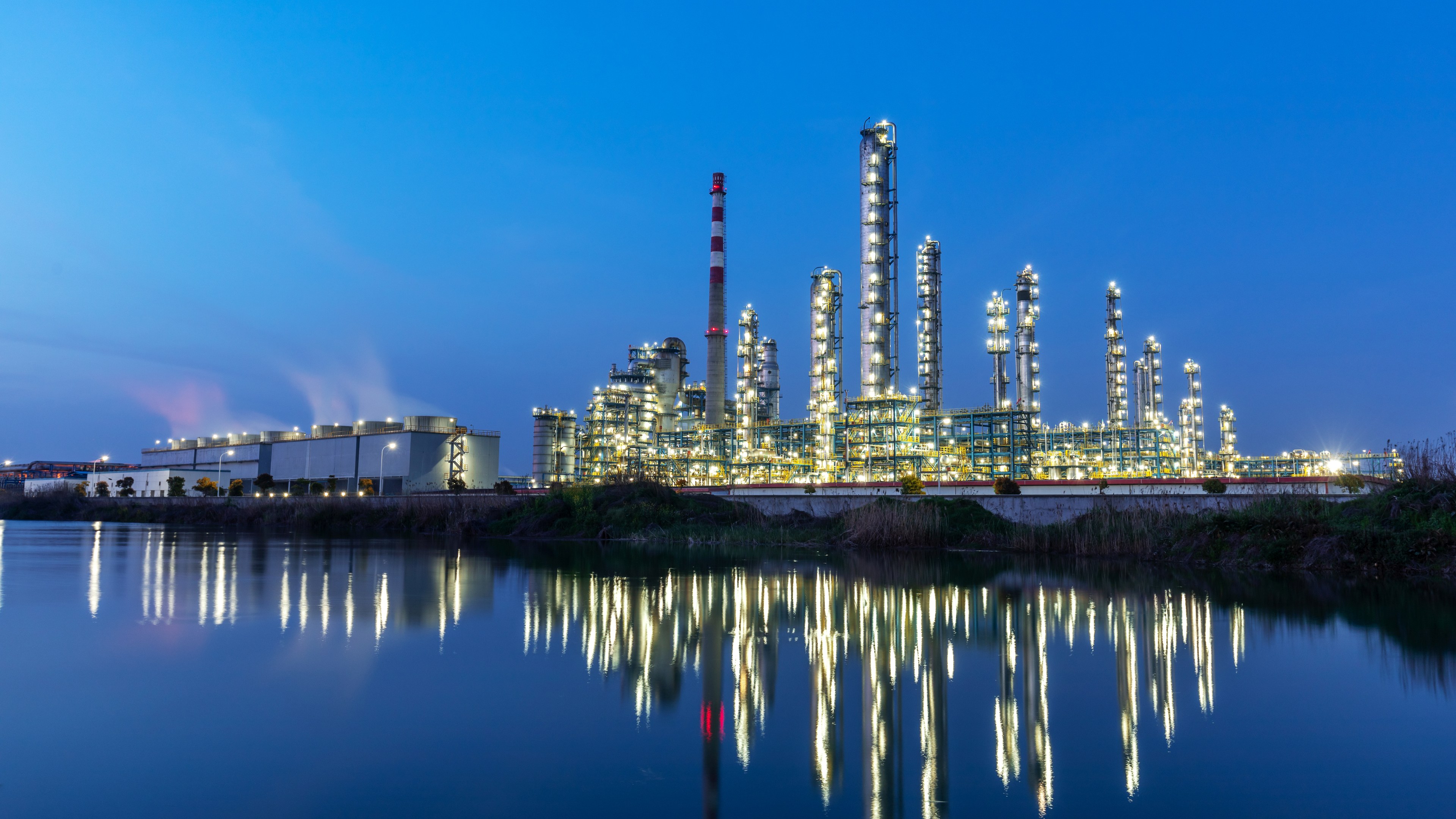 Industrial park by the lake in the evening with the lights on
