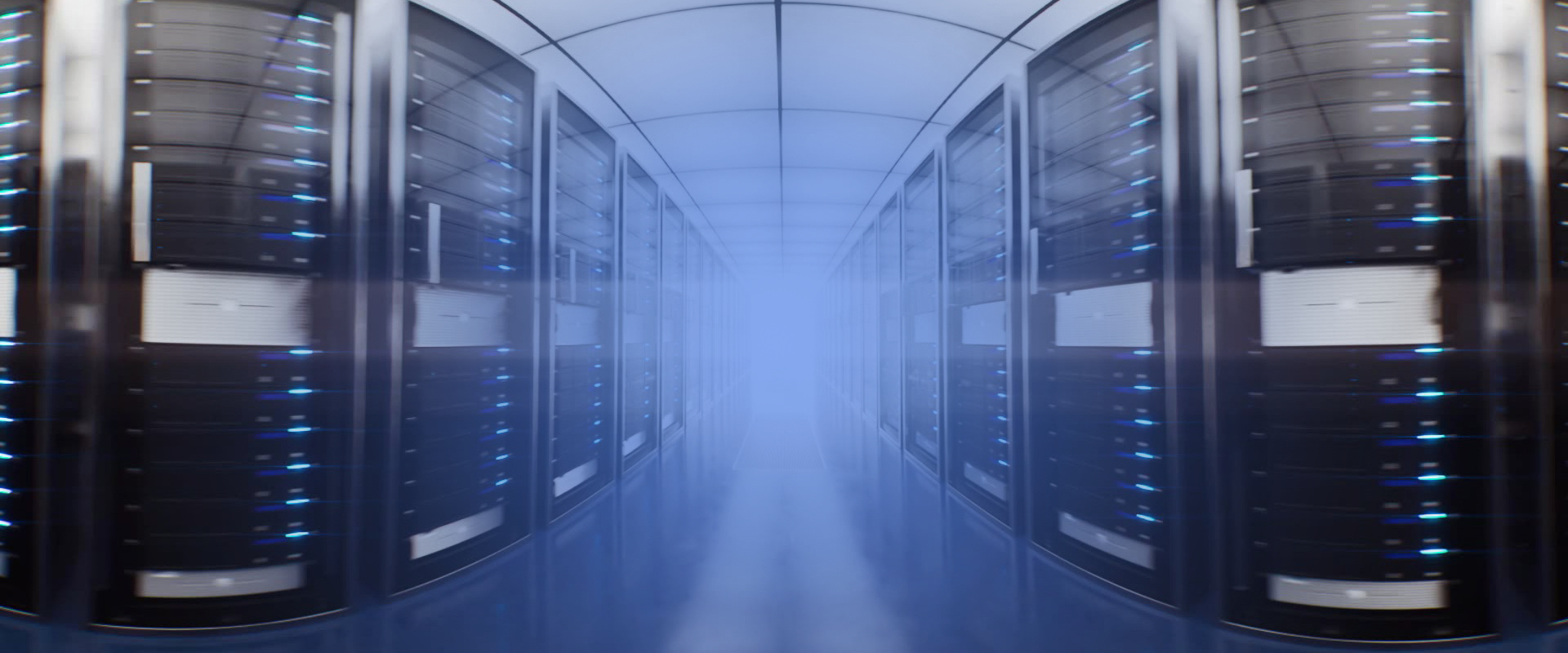 Aisle of a data center with racks with a blue blurred light in the center.