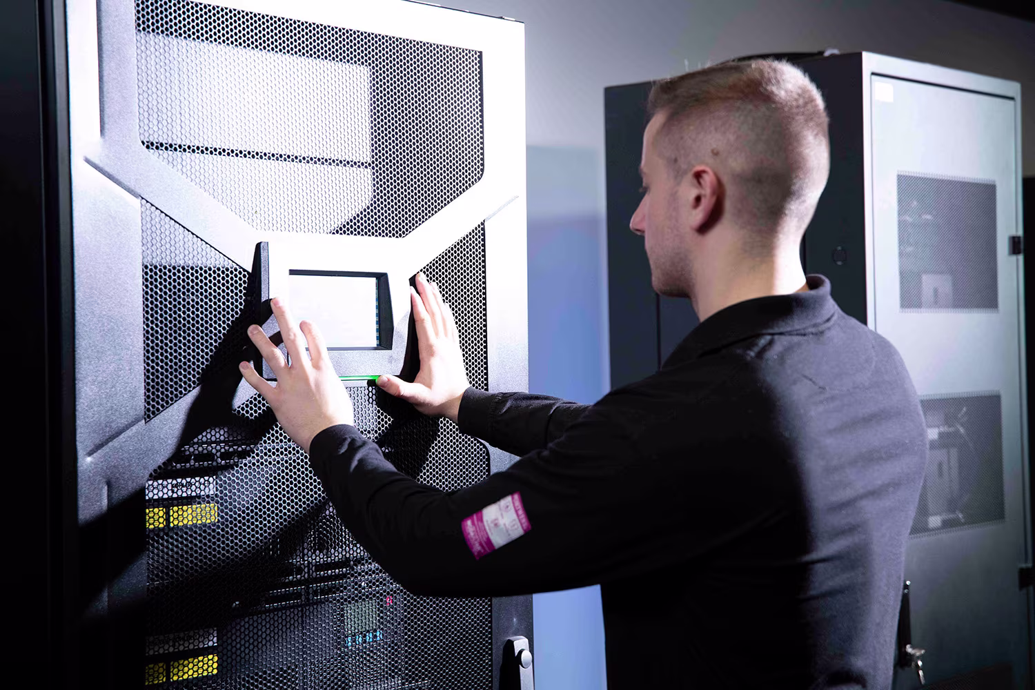 Technician servicing uninterruptible power equipment for continuous power protection.