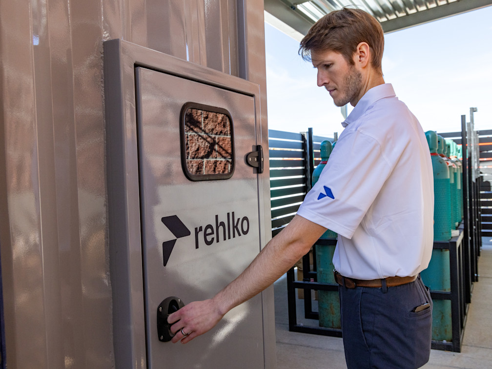 Filename: 902A7561
Klickitat Valley Health Toyota
Hydrogen Fuel Cell Systems
Rehlko employee in front of a panel door