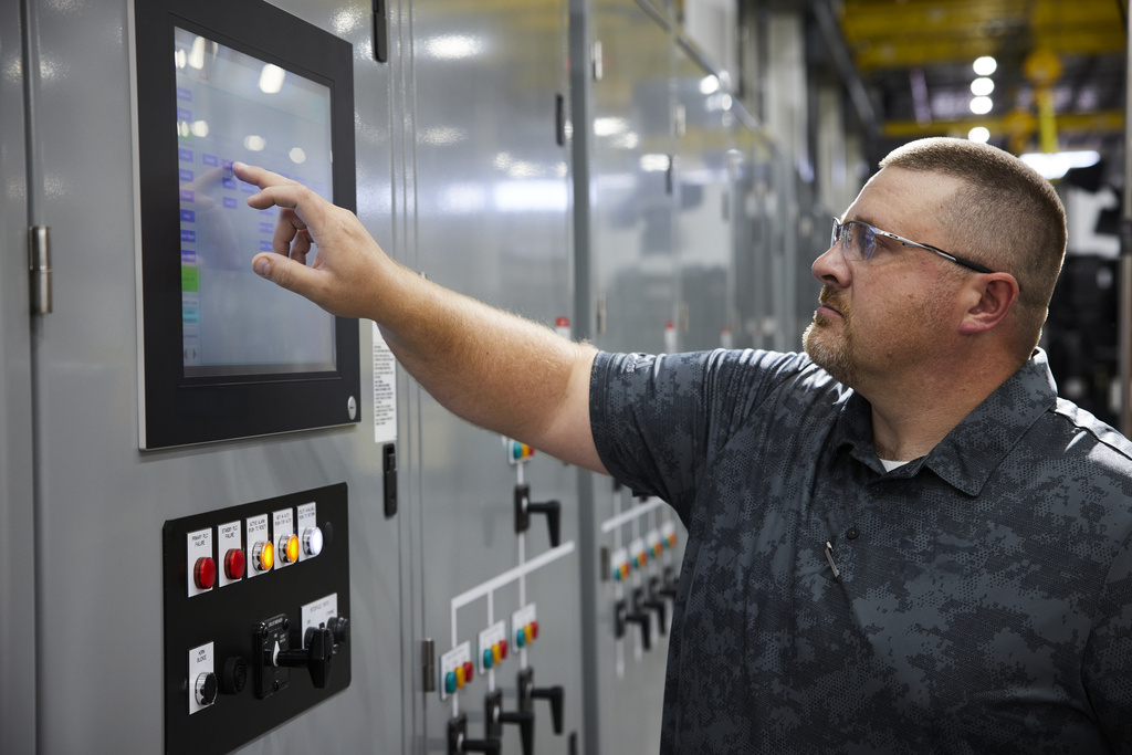 Male professional touching a panel