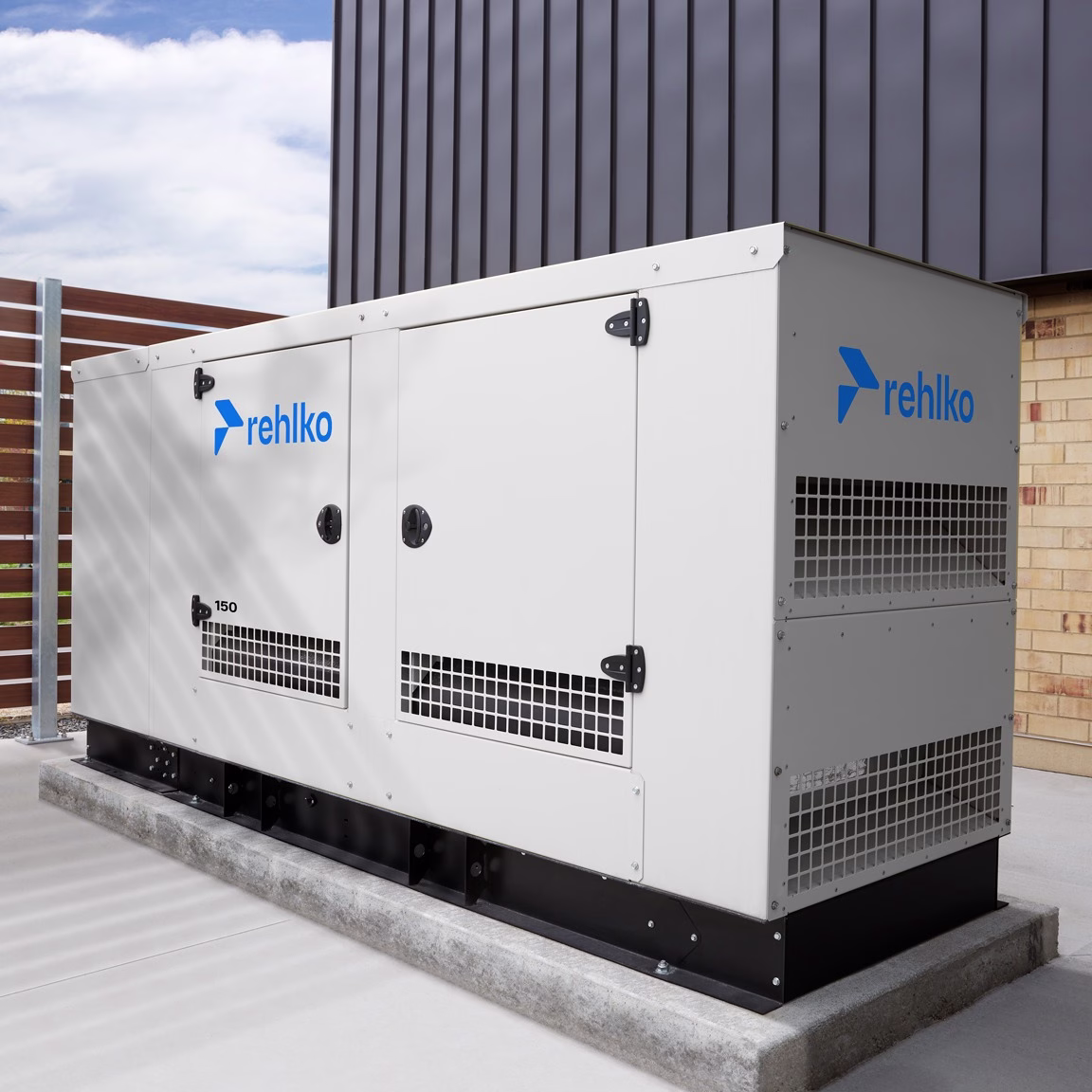 eFrame Enclusure on a cement stand with a wood paneled wall in the back