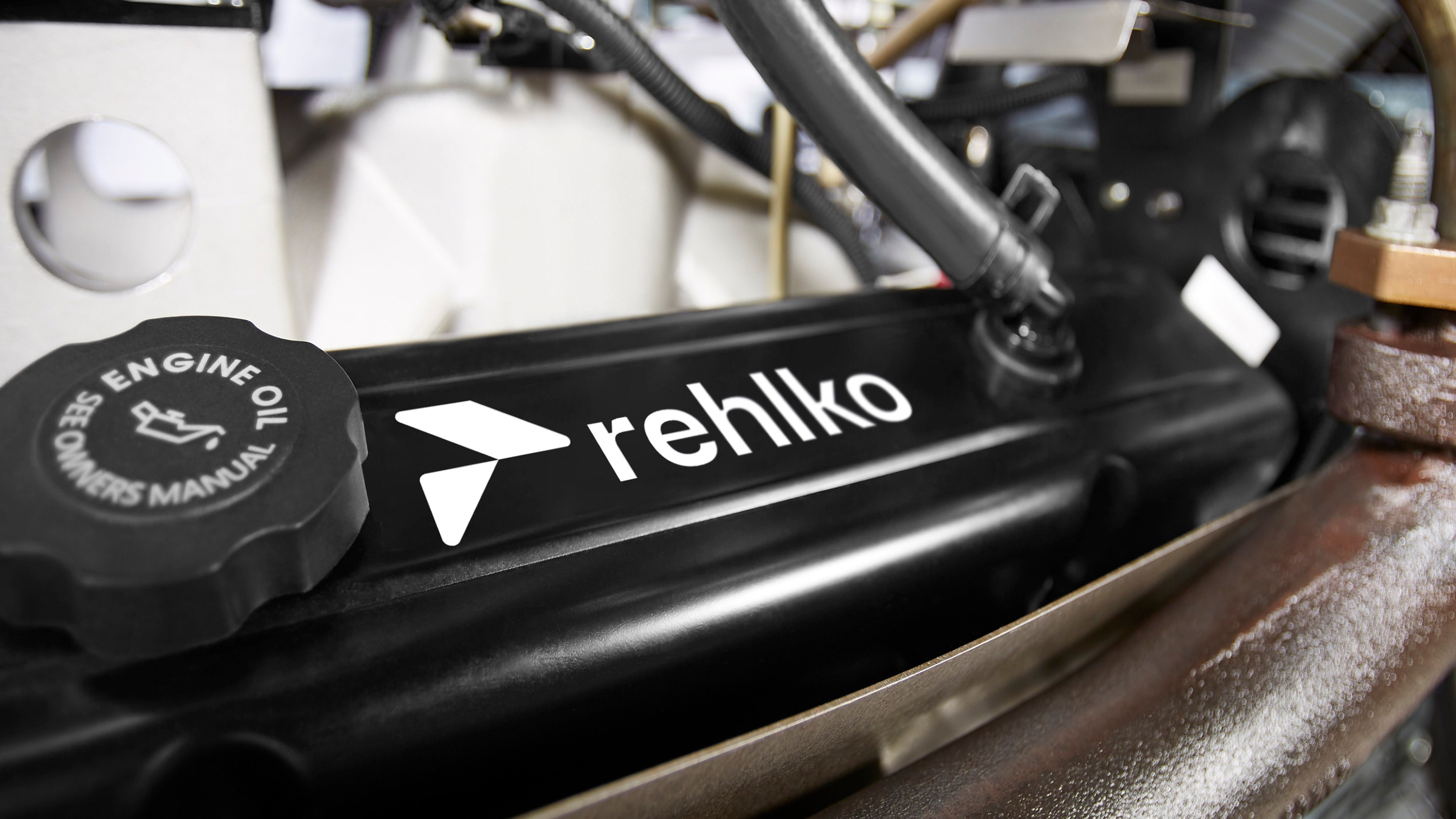 Zoom of Cap Engine with pipes and Rehlko logo