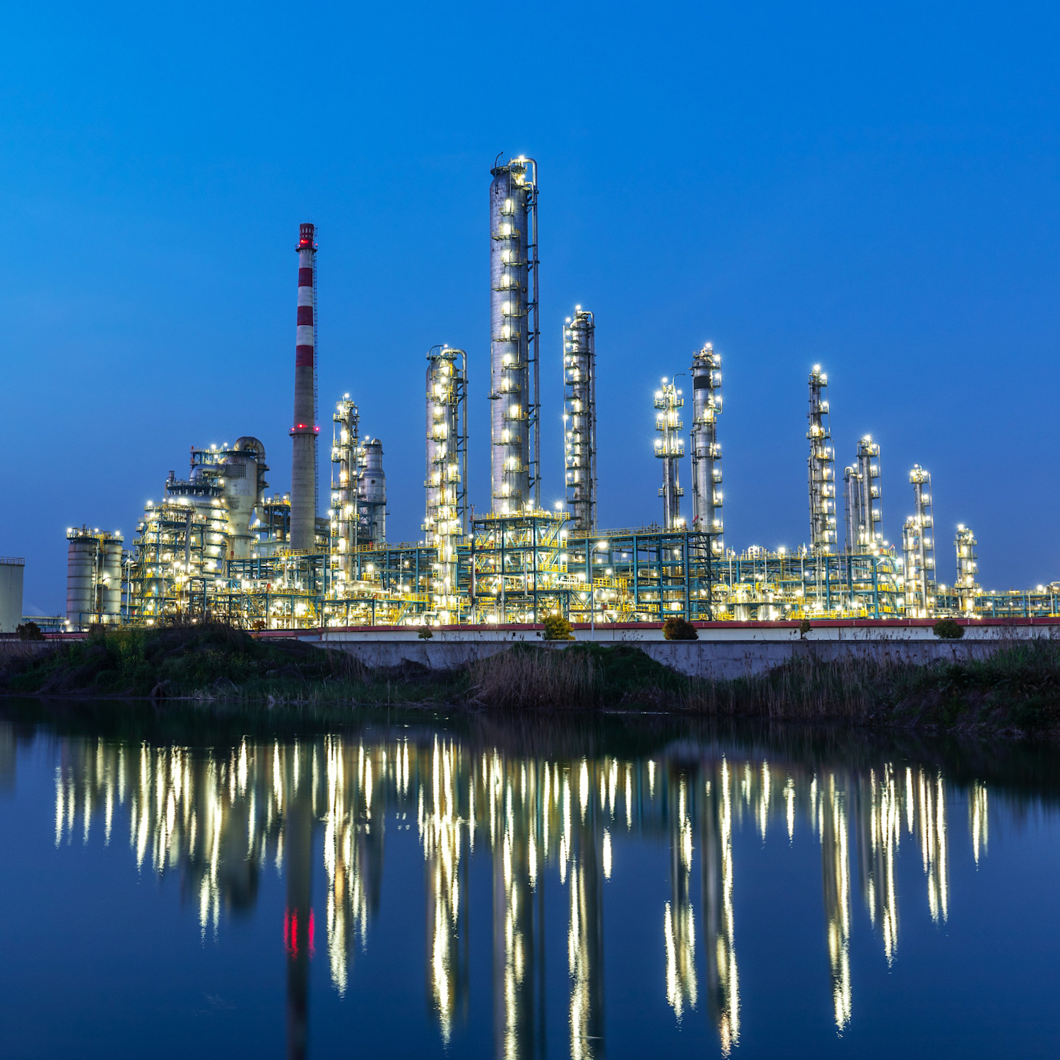Industrial park by the lake in the evening with the lights on