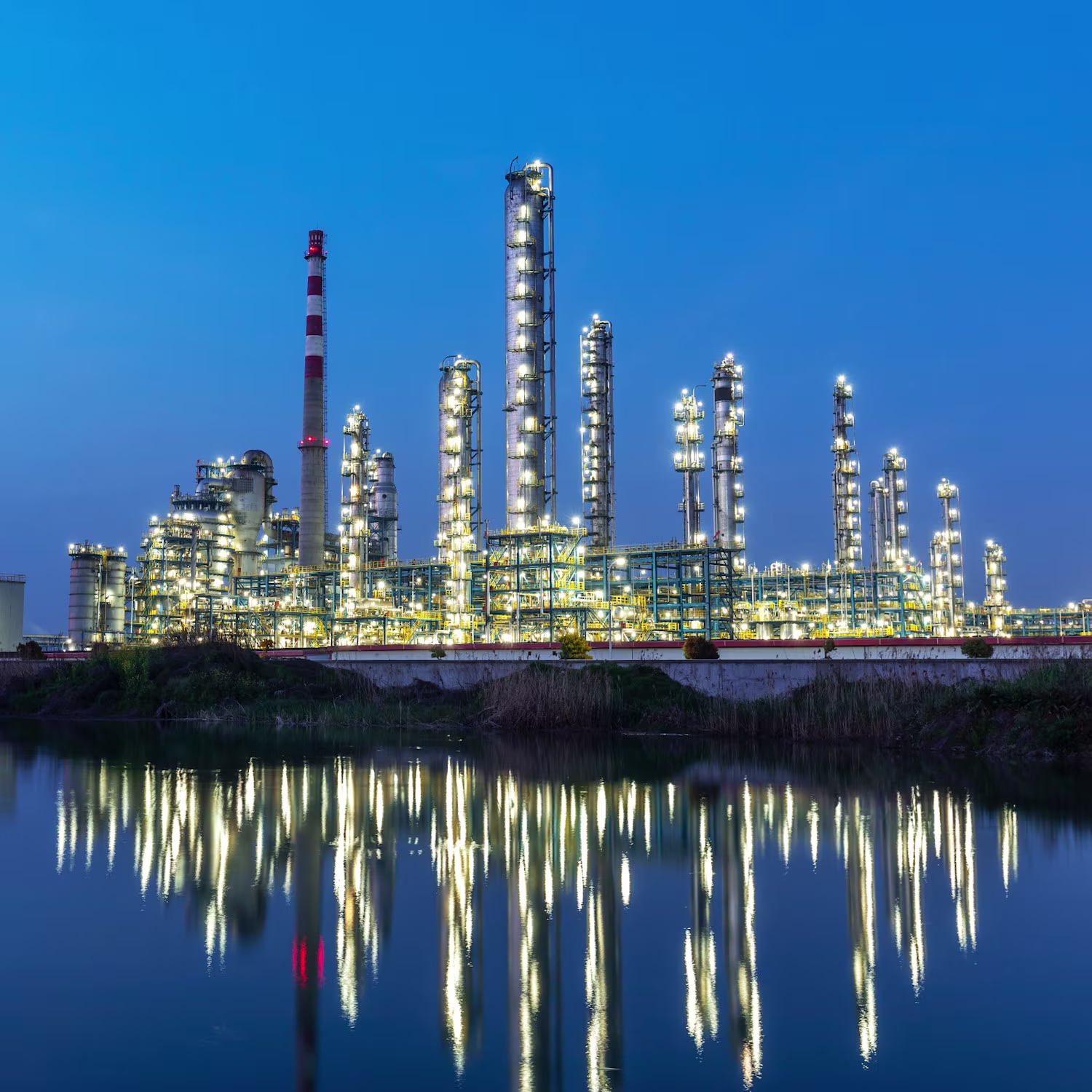 Industrial park by the lake in the evening with the lights on