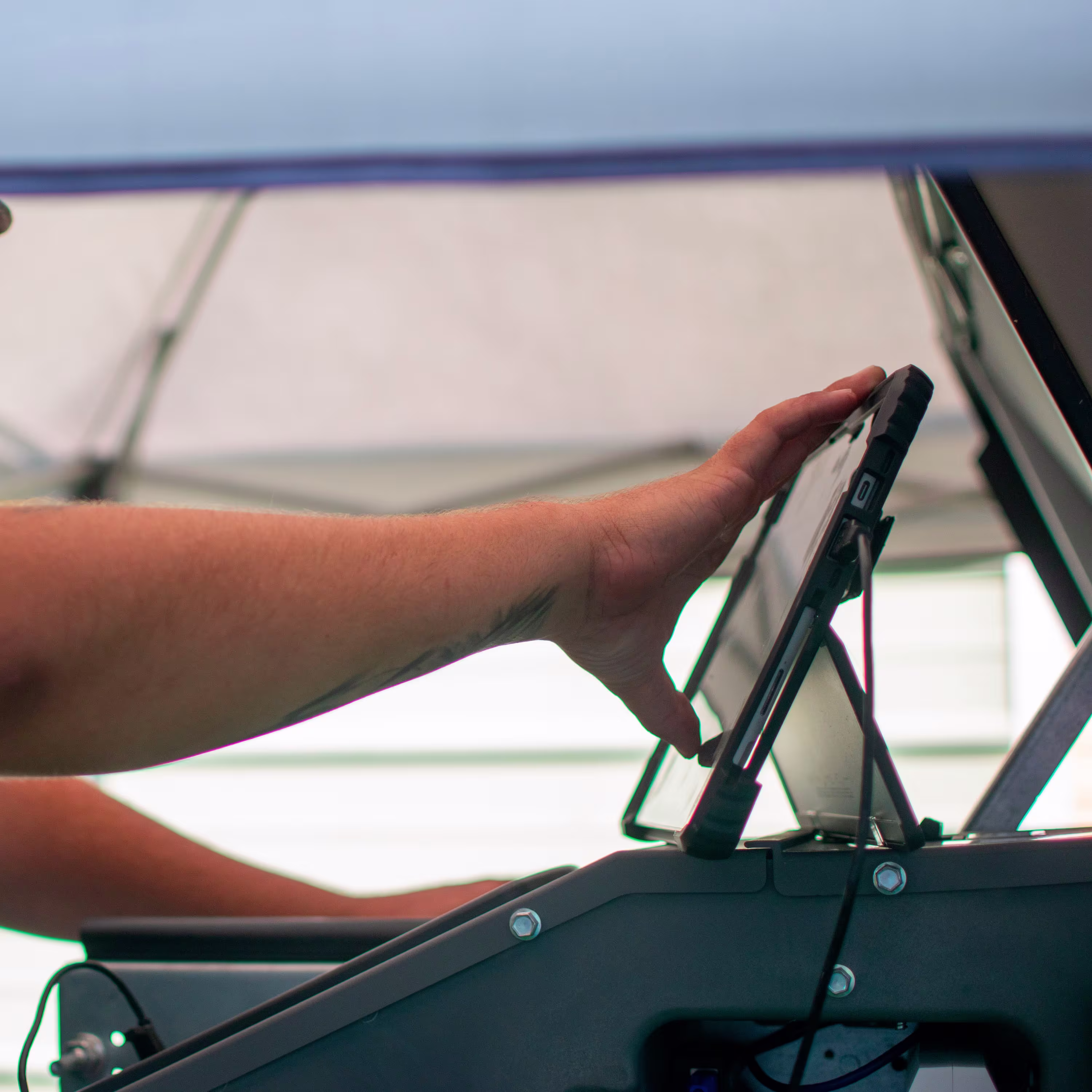 Person touching a screen over a generator
