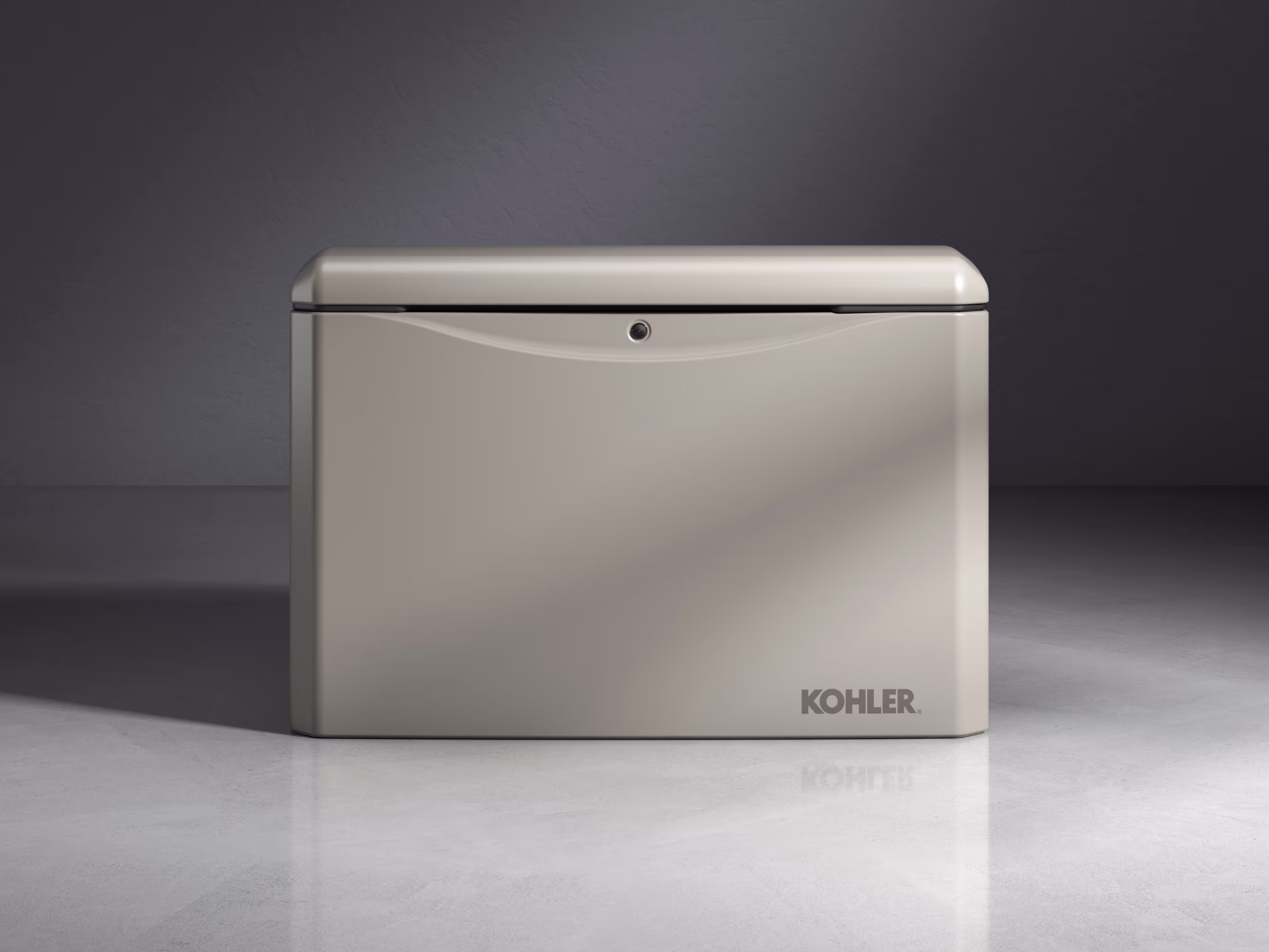A cream-colored KOHLER home generator on a shiny floor in which we can see its reflection.