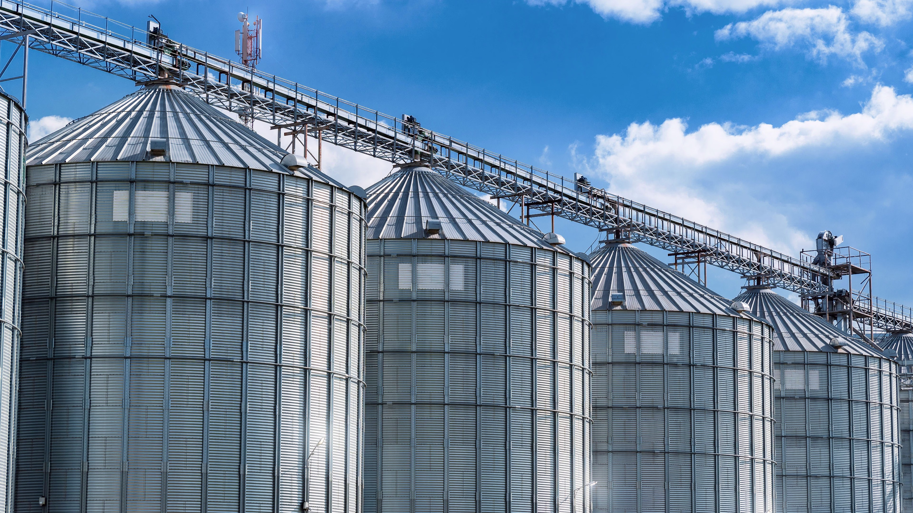Industrial grain storage and processing facility representing reliable energy infrastructure, operational resilience, and power solutions for agriculture and industrial applications.