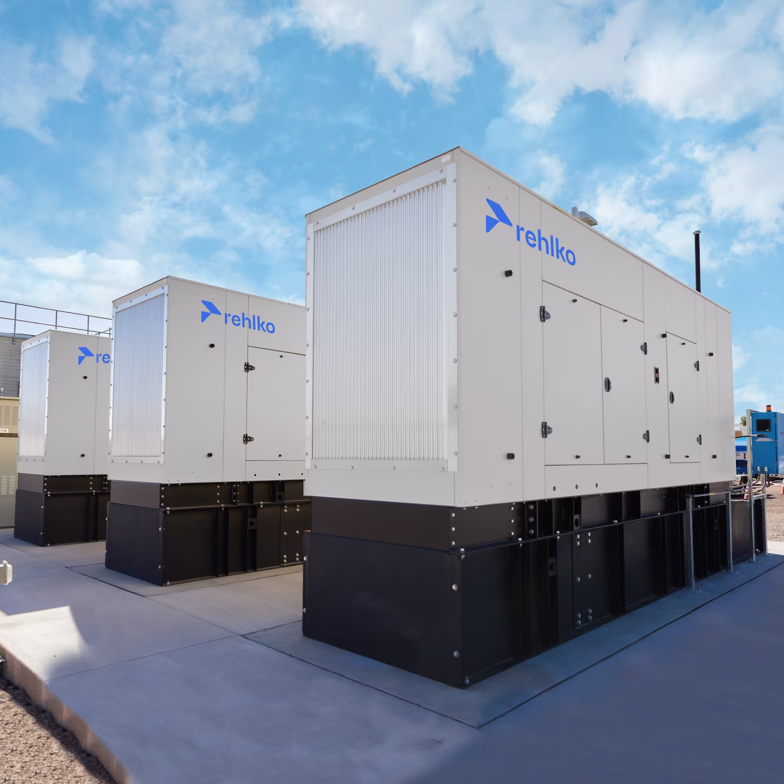 Three large enclosures installed on black floor bases