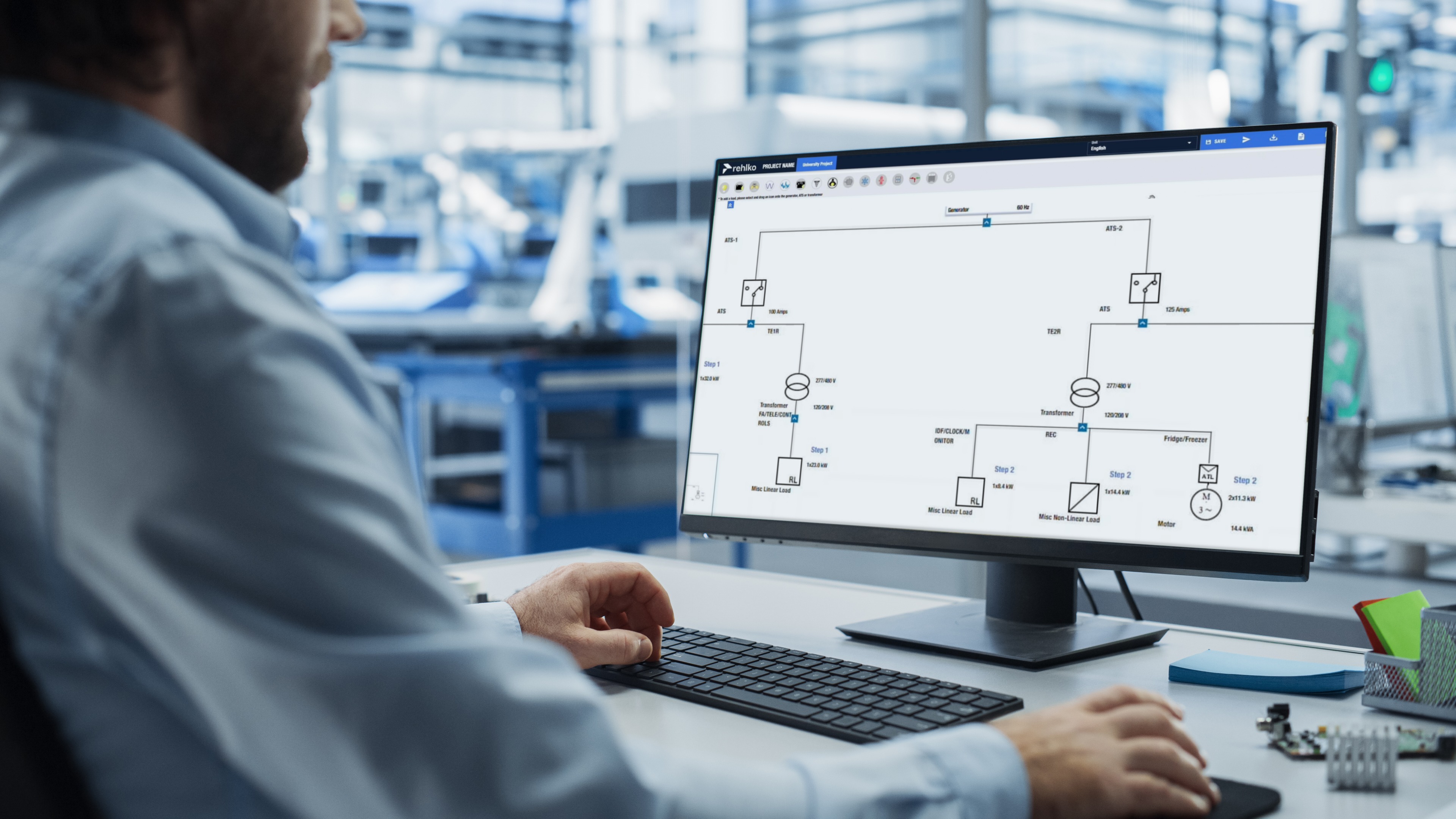 Man looking at a computer screen with a diagram showing the Rehlko Power Solutions Center Sizing Program