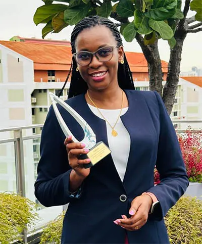 Dr Augustina Alexander with the 2024 OWSD-Elsevier Foundation Award for Early Career Women Scientists in the Developing World. 