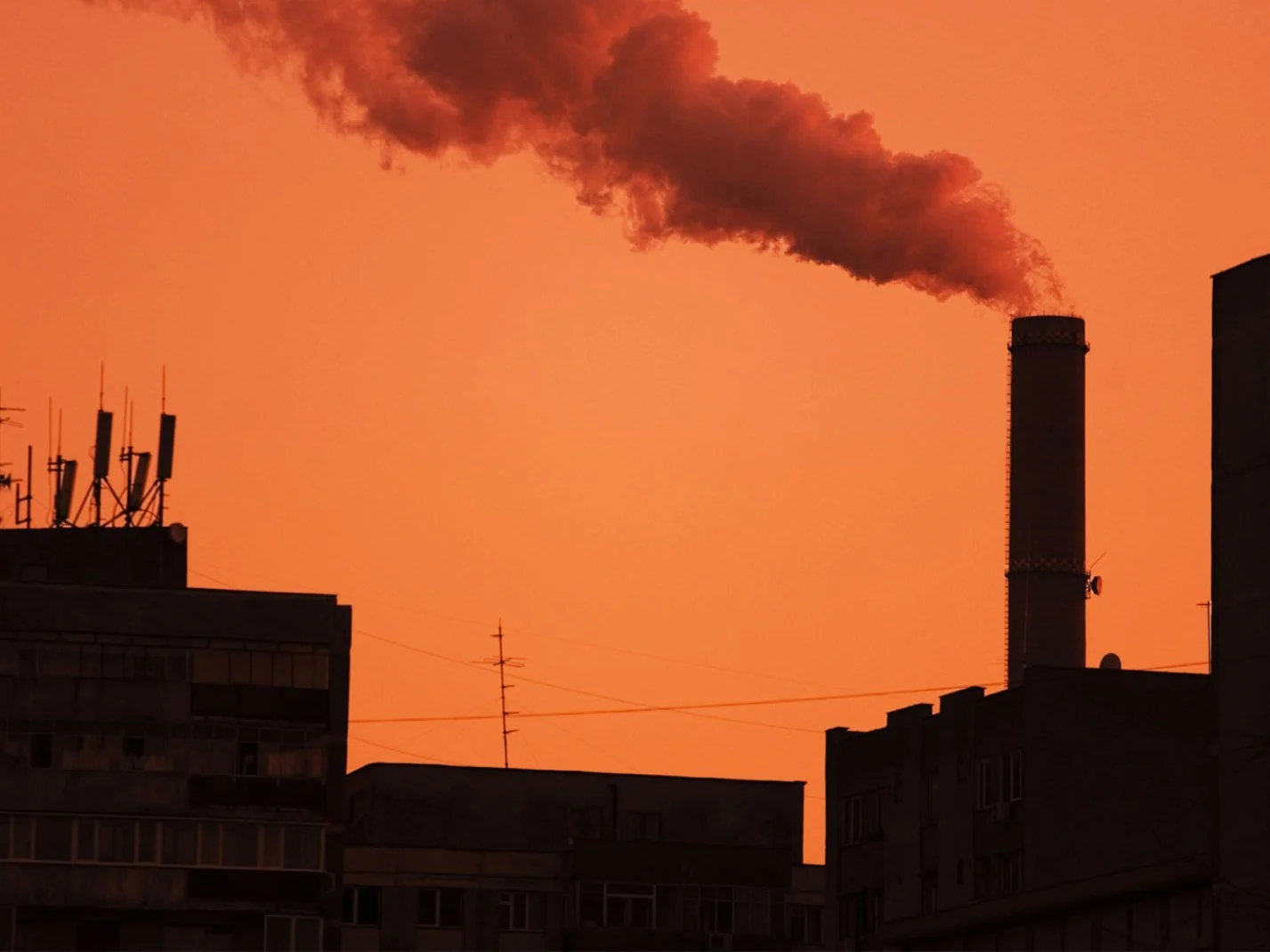 Industrial chimney polluting city