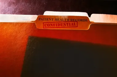 Patient health records folder with a confidential stamp