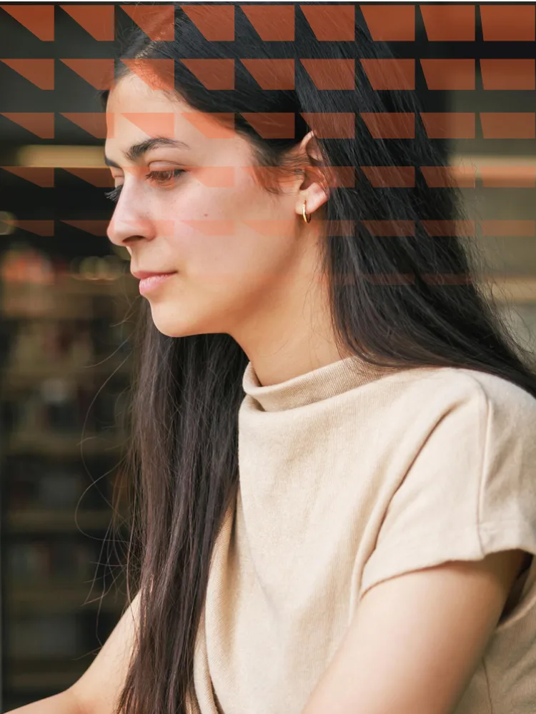 Female researcher working on her laptop in a modern office