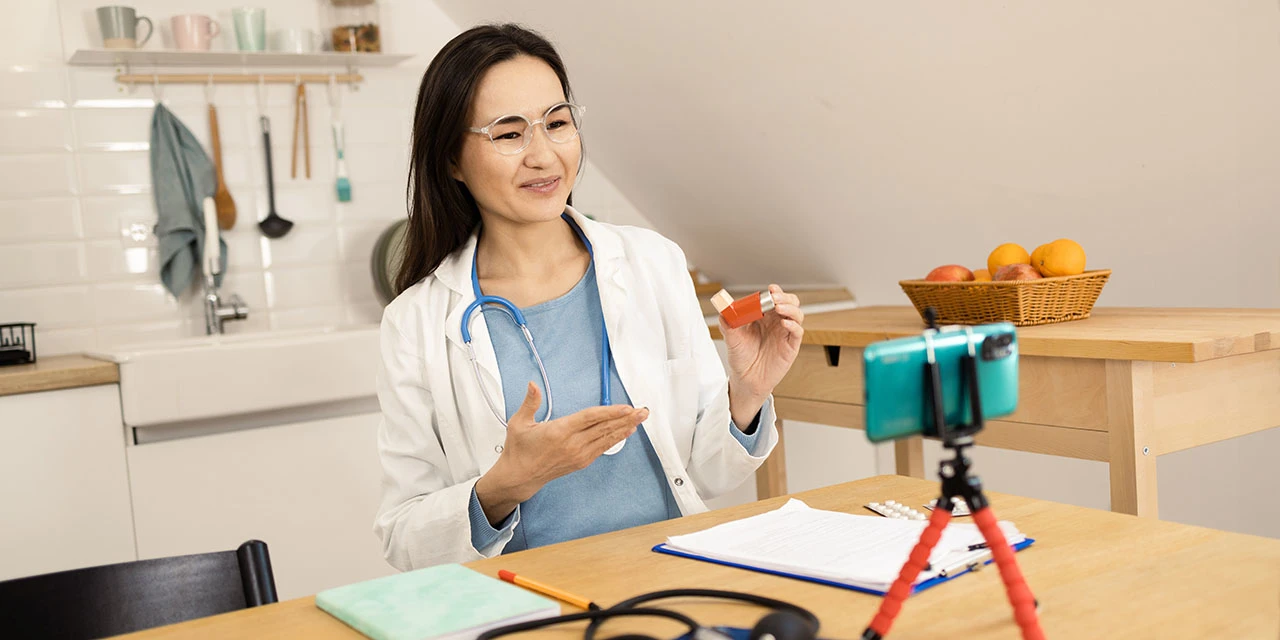 Photo depicting a female doctor making a home video about medication. (MixMedia/iStock/Getty Images Plus via Getty Images)