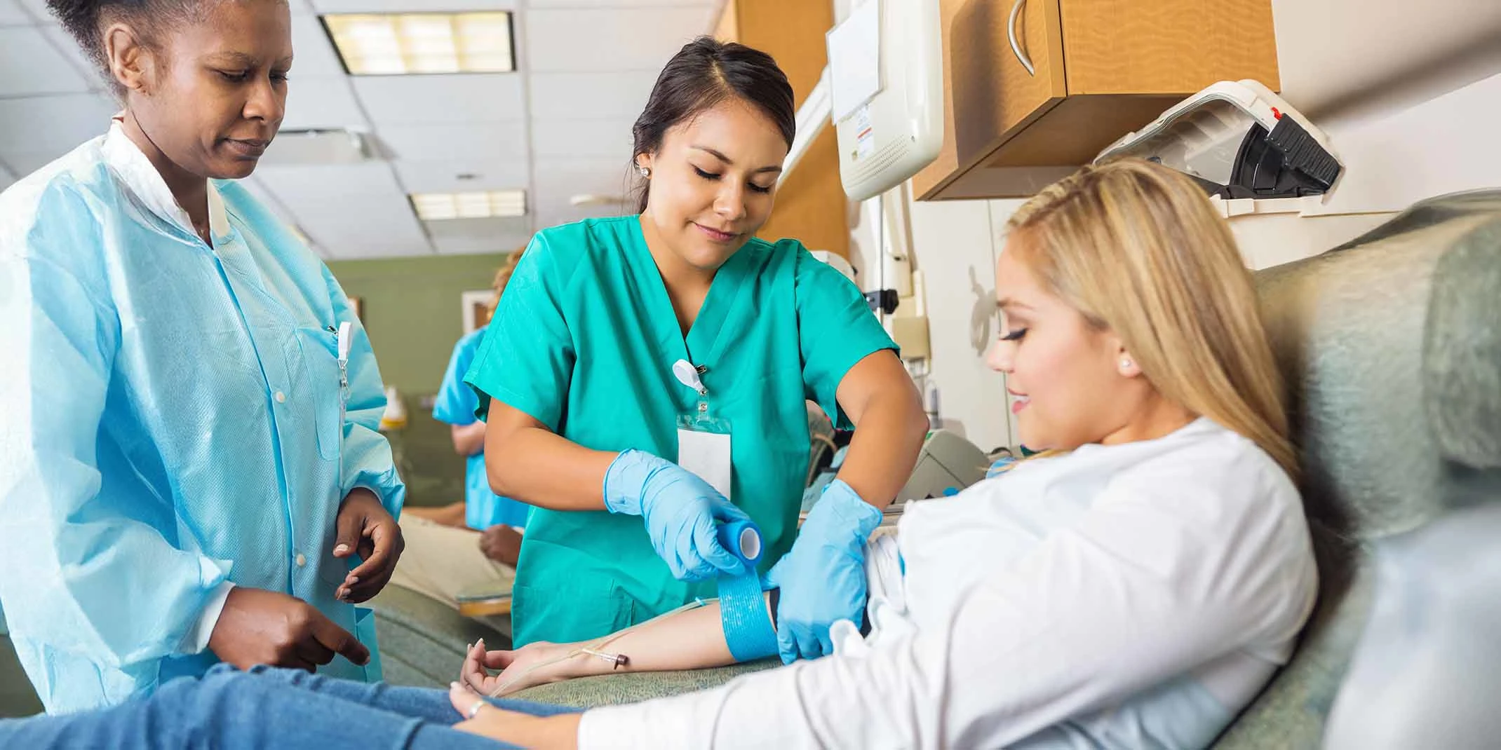 two nurse attending to a patient
