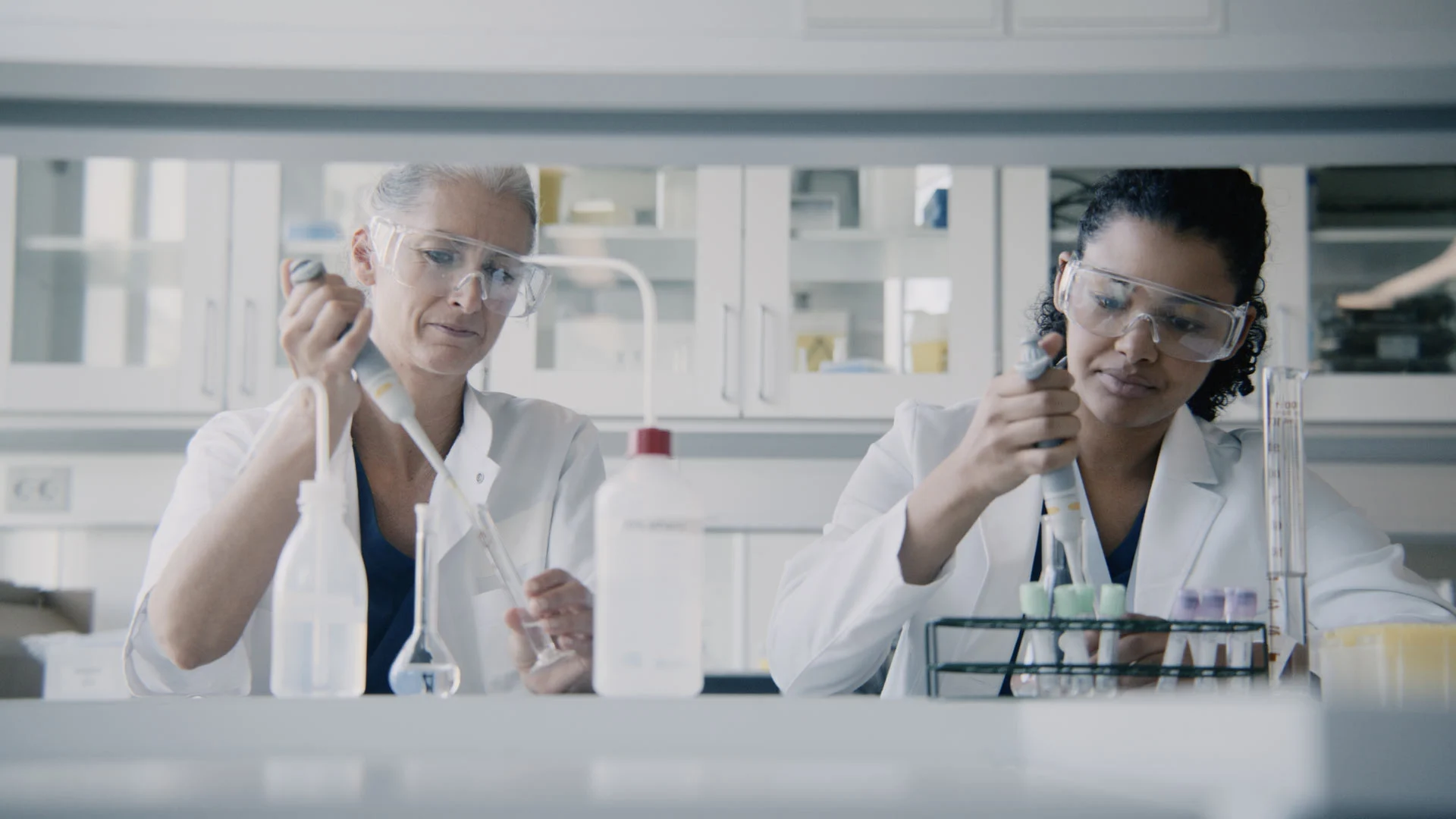 Two female chemists working in the lab