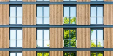 Structural engineers can help reduce emissions in how they select building materials and reuse existing materials and structures. This building is made with wood, a renewable and sustainable material. (© istock.com/IGphotography)IGphotography